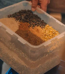 Box of dried botanicals and spices for maceration