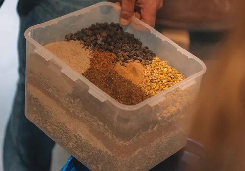 Box of dried botanicals and spices for maceration