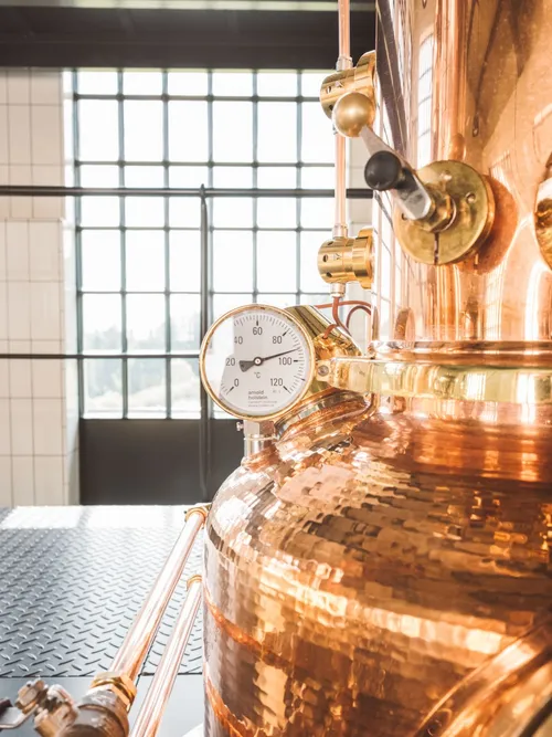 Copper still with thermometer gauge