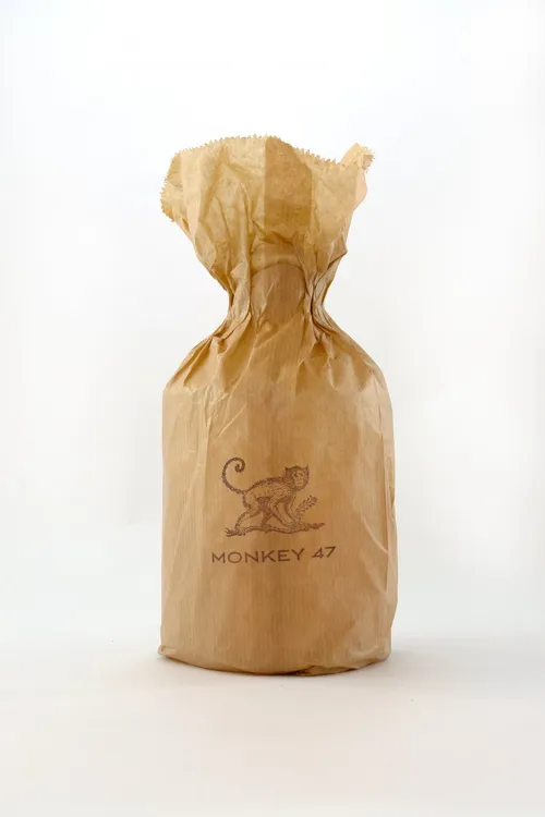 Monkey 47 bottle wrapped in brown paper