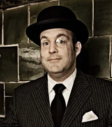 Portrait of Alexander Stein in a bowler hat and suit