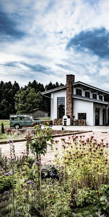 Monkey 47 distillery building in the Black Forest with a garden