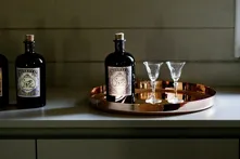 Monkey 47 bottles and glasses on a copper tray
