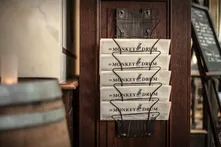 Monkey Drum newspapers in a wooden rack
