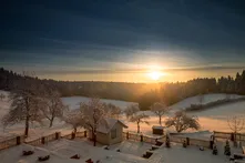 Sunset over a snowy Black Forest landscape