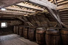 Rows of oak barrels in the granary attic