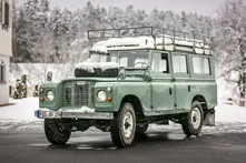 Vintage green Land Rover in the snow