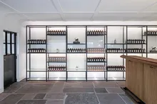 Tasting room with bottle shelves and wooden counter