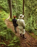 Two foragers walking along a Black Forest trail
