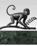 Species Rara Award: bronze monkey sculpture on a green marble base