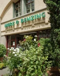 Merz & Benzing shop entrance in the Stuttgart Market Hall with plants and flowers