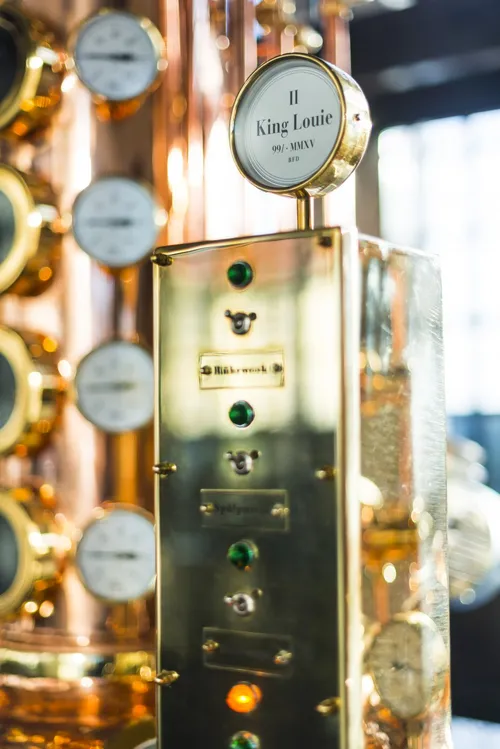 Monkey 47 copper still column with a named brass plate