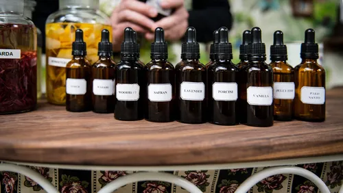 Row of dropper bottles with infusions on a bar