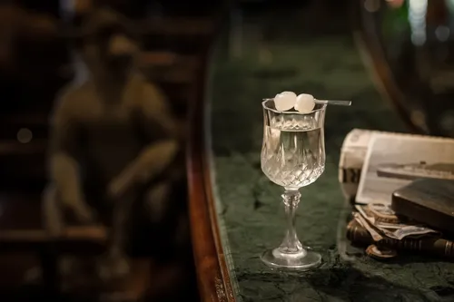 Gibson cocktail with pearl onions on a bar