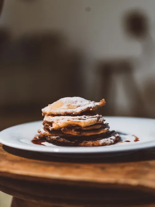 Stack of apple fritters on a plate
