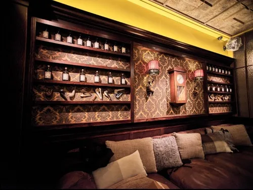 Interior of Arthur Orlans bar with shelves and sofas