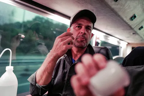Bartender holding up an ice cube