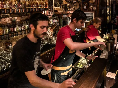 Bartenders mixing drinks at the Dead Rabbit bar