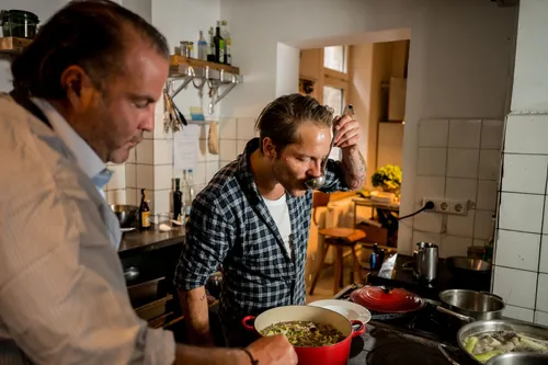 Two chefs cooking at the stove
