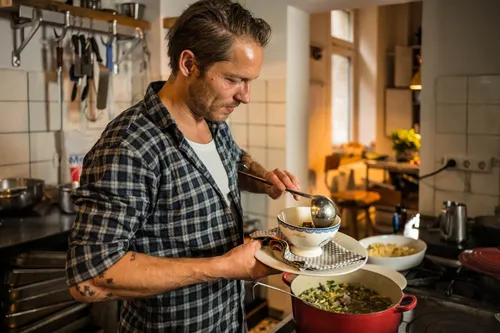 Chef ladling stew into a bowl