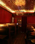 Senator Saloon bar interior with red walls and a pressed tin ceiling