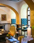 Interior of Josef Cocktailbar in Vienna with velvet seats and chandeliers
