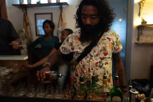 Bartender preparing drinks at a bar counter
