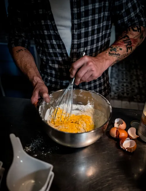 Whisking egg batter in a bowl