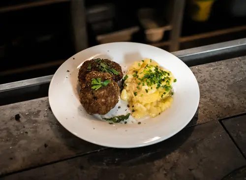 Swabian meat patties with potato salad and parsley