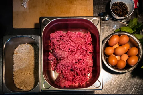 Minced meat, breadcrumbs and eggs ready for meatballs