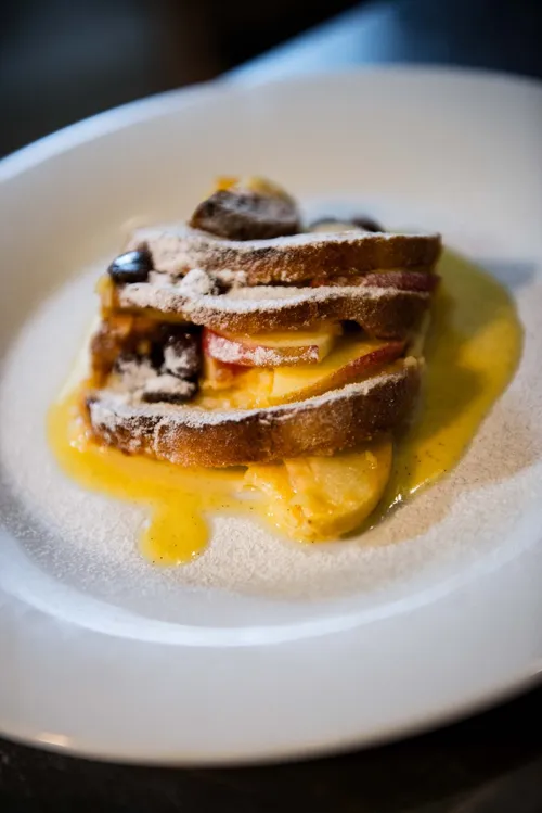 Slice of bread pudding with vanilla sauce