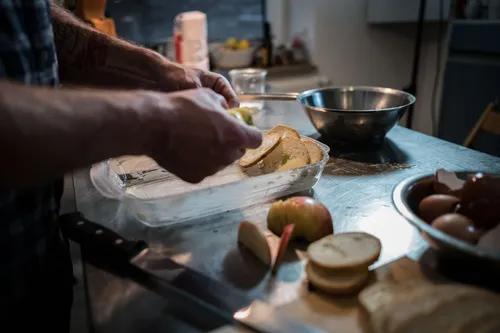Preparing bread pudding at the kitchen counter