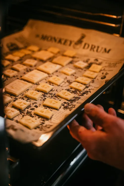 Tray of Springerle biscuits going into the oven