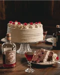 Black Forest gateau with a Monkey 47 bottle and a slice on a plate