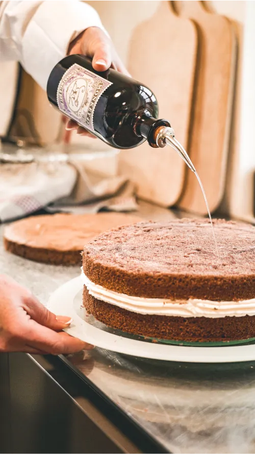 Drizzling Monkey 47 over a chocolate sponge layer