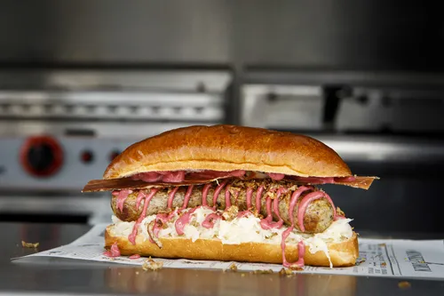 Wundersarnie sandwich with pickled onions on paper
