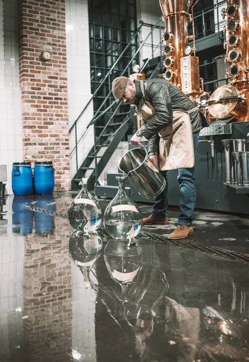 Distiller at work in the London distillery