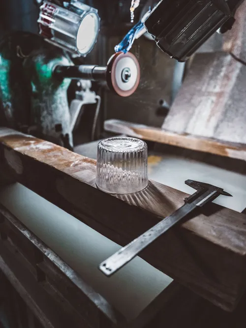 Glass grinding machine in a workshop