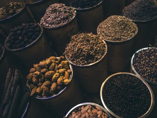 Bowls of spices and dried botanicals at the market