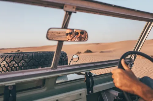 Driving a 4x4 through the desert dunes