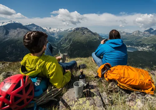 Two climbers resting on a mountainside