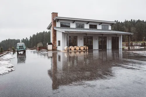 Monkey 47 distillery with oak barrels in the rainy courtyard