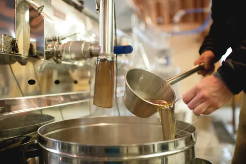Maple sap being processed in steel machinery