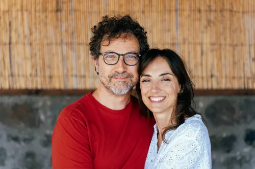 Smiling couple of caper farmers