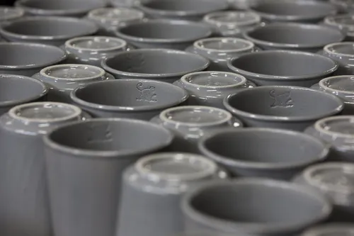 Rows of glazed grey Becher cups