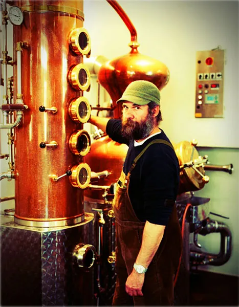 Monkey 47 distiller in front of the copper still