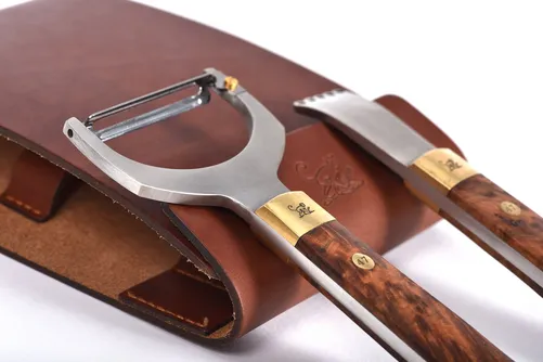 Monkey 47 zester and peeler in a brown leather case