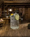 47Up highball with lime in a rustic miniature bar setting