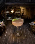 Audrey 47 cocktail in a coupe with a lime wheel
