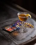 Bijou Cocktail with an orange twist next to a jewellery box